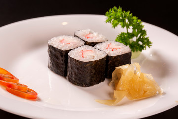 Sushi plate on black background