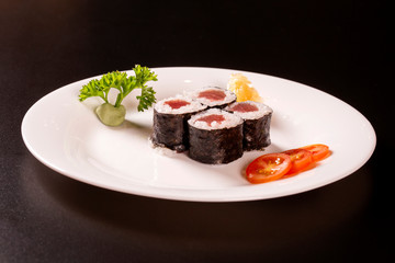 Sushi plate on black background