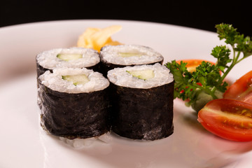 Sushi plate on black background