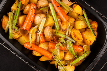 roasted potatoes with grilled vegetables, carrots, onions and garlic
