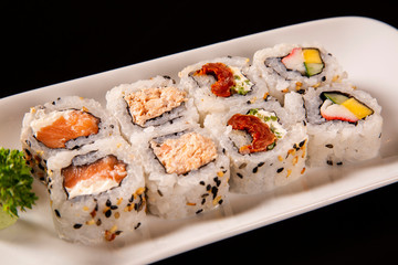 Sushi plate on black background