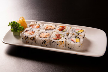 Sushi plate on black background