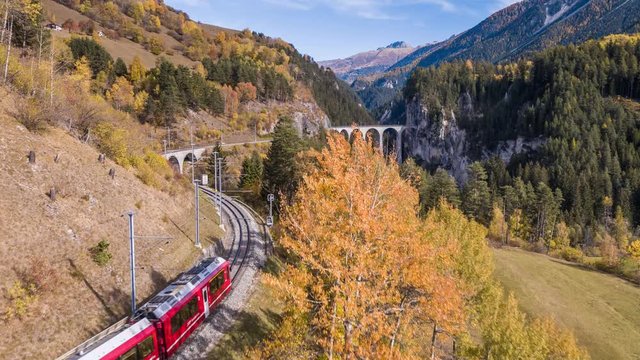 Following a train on the viaduct Landwasser in Swiss mountains during the autumn. Filmed with the DJI Inspire 2 drone in 5.2k RAW resolution and downscaled to 4k.