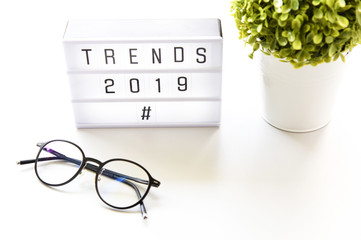 TRENDS 2019 text on lightbox composition on white table background copy space,Business Concept.