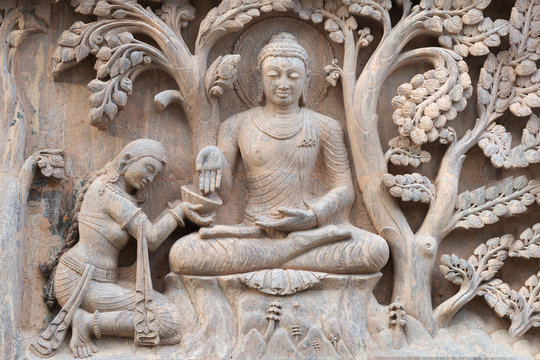 Stone statue of buddha at Mahabodhi Temple Complex in Bodh Gaya, India
