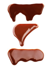 Set of melted chocolate dripping on white background