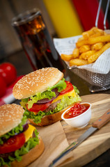 Burger with French fries cutlet with cheese and tomato