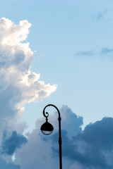 Silhouette of a street lamp on the background of the beautiful sky