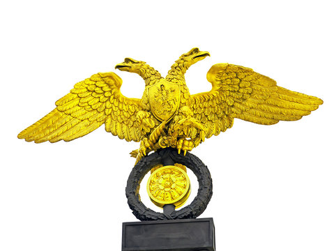Golden two-headed eagle statue isolated