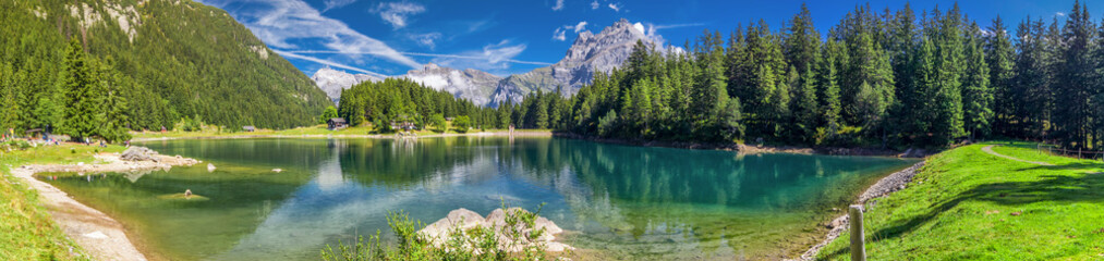 Fototapeta na wymiar Arnisee with Swiss Alps. Arnisee is a reservoir in the Canton of Uri, Switzerland, Europe