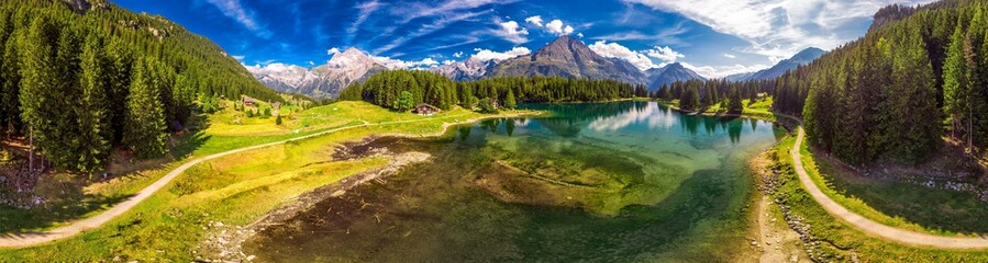 Fototapeta na wymiar Arnisee with Swiss Alps. Arnisee is a reservoir in the Canton of Uri, Switzerland, Europe