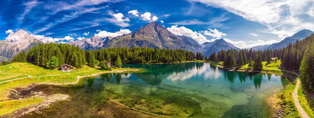 Arnisee with Swiss Alps. Arnisee is a reservoir in the Canton of Uri, Switzerland, Europe - obrazy, fototapety, plakaty