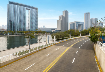 Obraz premium Empty road floor surface with modern city landmark buildings of hangzhou bund Skyline,zhejiang,china