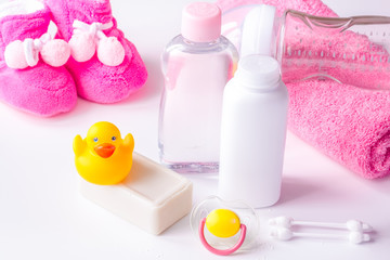 Obraz na płótnie Canvas baby organic cosmetic for bath on white bakground