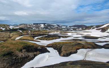 Colorful rhyolite mountains covered with snow in Jokultungur geothermal area, Laugavegur, Fjallabak Nature Reserve, central Iceland
