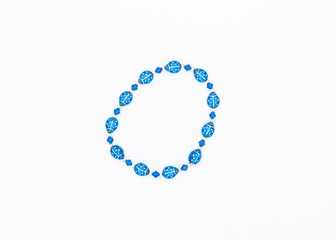 blue colored and variously sized beads bracelet on white background