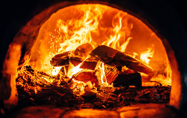 Firewood burning at the furnace close up