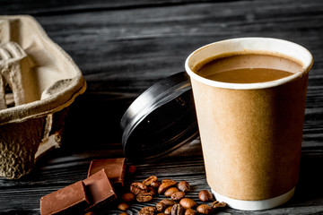 coffee cup to go at wooden background