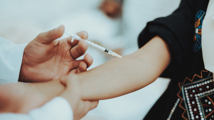 Close Up Doctors hand Doing Injections to Woman