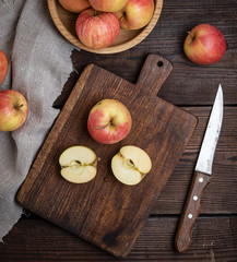 ripe red apples, chopping wooden board