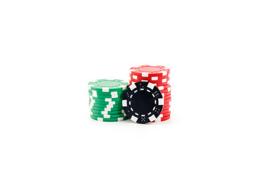 Casino games concept,Stacks of poker chipson gamble table including red, black, white, green and blue on a white background.