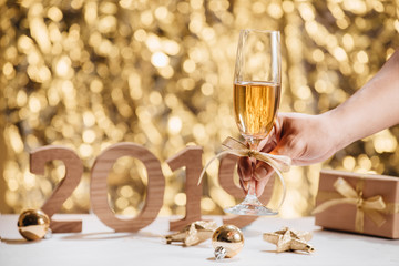 New Years Eve celebration background with pair of flutes, bottle of champagne