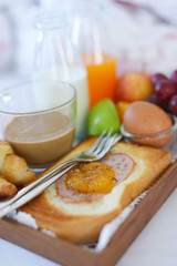 Breakfast on bed with coffee, croissants Window light
