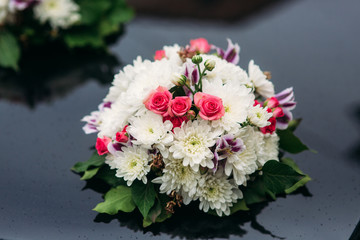 Flowers on the car. wedding day. autumn