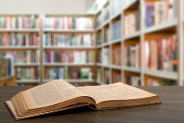 Open book on old wooden table