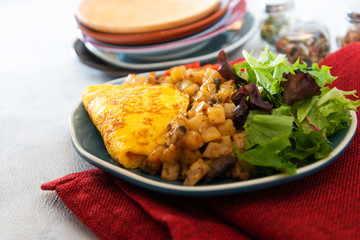 French Omelette with Potatoes, Mushroom and Salad