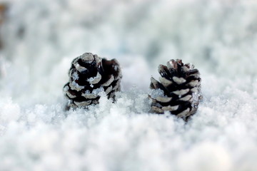 Snow man with a Christmas ornament on a snow background blur.