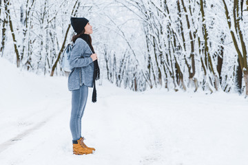 smiling woman portrait outdoors snow on hat