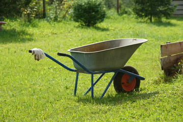 Empty garden metal wheelbarrow cart