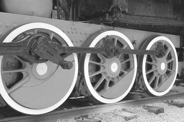Fototapeta na wymiar black and white photo of old retro steam locomotive wheels
