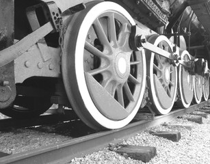 Fototapeta na wymiar black and white photo of old retro steam locomotive wheels