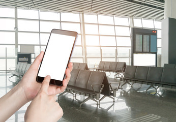 Man using smart phone mobile in the airport terminal