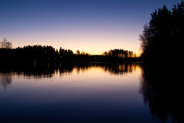 Fototapeta premium Sunrise and reflection over a lake