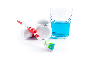 Toothbrush, toothpaste, dental floss and mouthwash isolated on white background