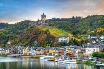 Cochem in autumn, Germany. Cityscape with Moselle river, colorful houses on embankment and Cochem...