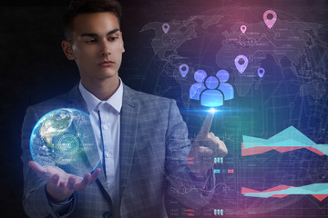 The concept of business, technology, the Internet and the network. A young entrepreneur working on...