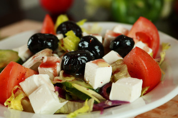 Vegetable salad with olives, tomato and feta cheese