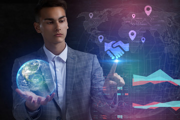 The concept of business, technology, the Internet and the network. A young entrepreneur working on a virtual screen of the future and sees the inscription: