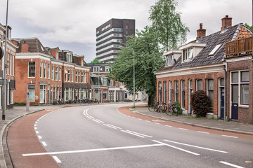 Typical street of the Dutch buildings and bicycles. Local architecture in Groningen, The Netherlands.