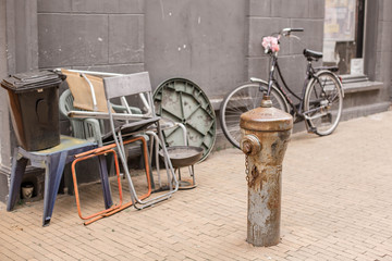 Unusual street with trash and bike. Holland, Netherlands.