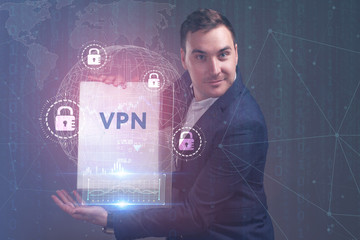 The concept of business, technology, the Internet and the network. A young entrepreneur working on a virtual screen of the future and sees the inscription: VPN