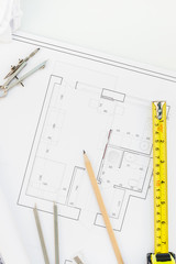 Interior designer table workplace with house plan