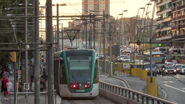 Vibrant  Time Lapse in a Busy Avenue with Traffic, Tram, Cranes in the Street repair works. Downtown Barcelona. Zoom In