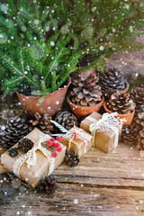 spruce branches and Christmas decor on  wooden background. decor toy Christmas still life.  soft focus, toning