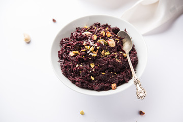 Beetroot Halwa garnished with Pistachio served in a bowl, selective focus