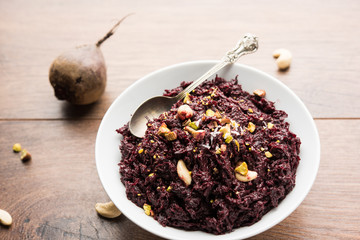 Beetroot Halwa garnished with Pistachio served in a bowl, selective focus